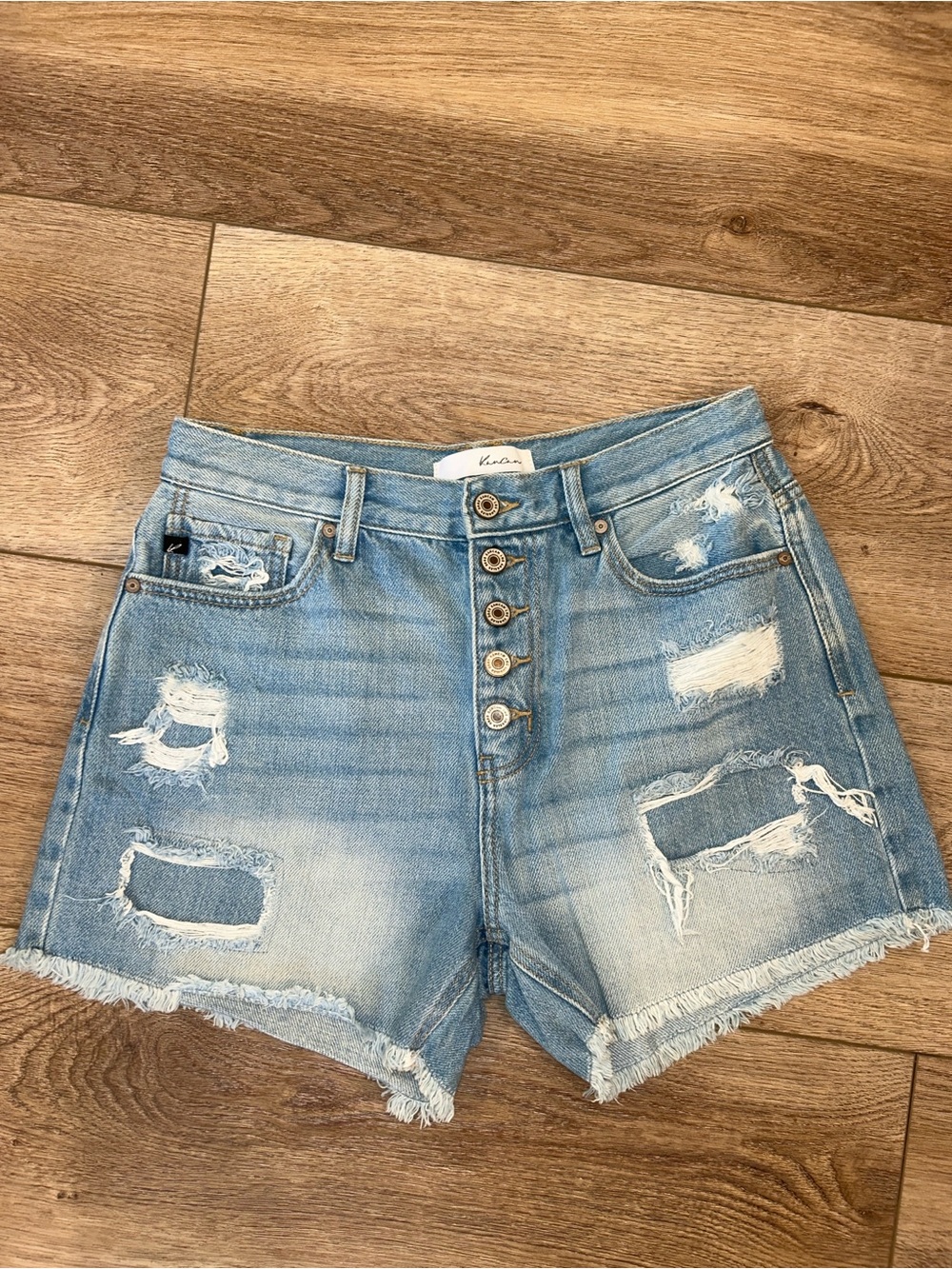 Kancan from the Light Blue button fly Distressed High-Rise cut off Denim Shorts